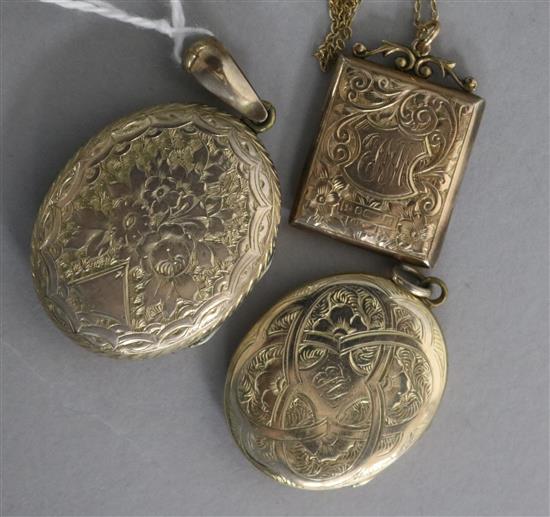 An early 20th century 9ct gold locket and 9ct gold chain and two other lockets.